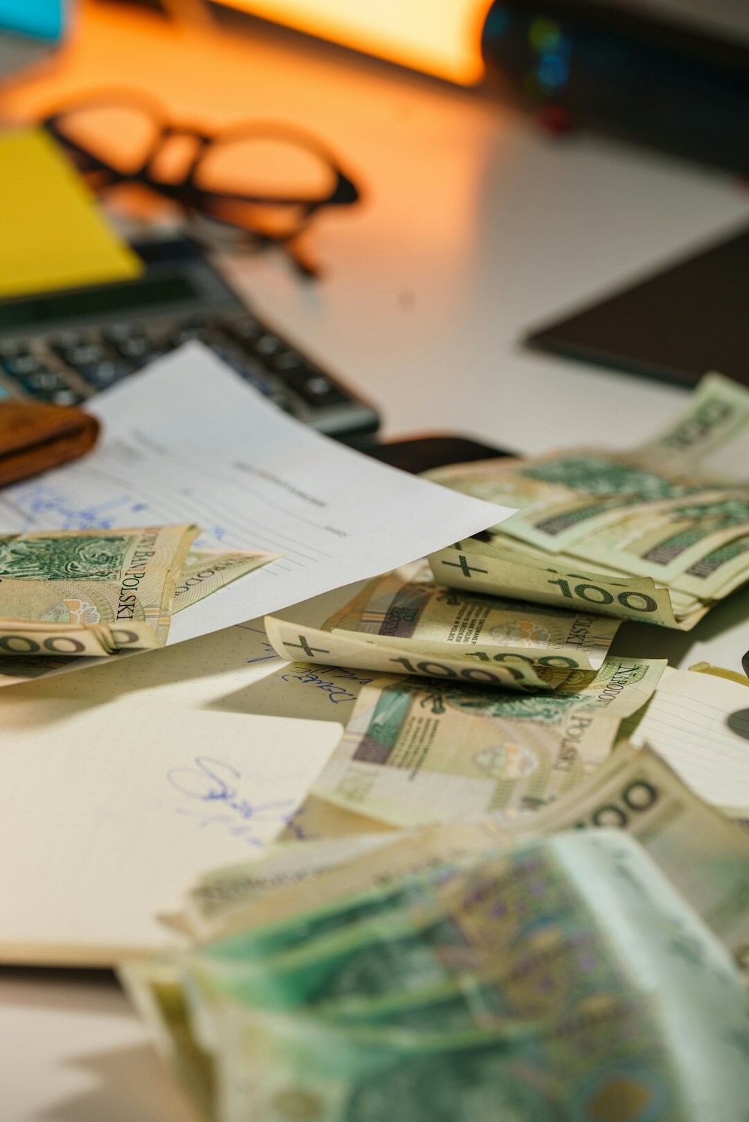 pile of money and contracts